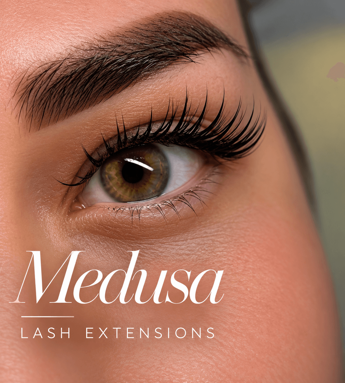 Hazel eye with long, dark lash extensions and the text Medusa Lash Extensions.