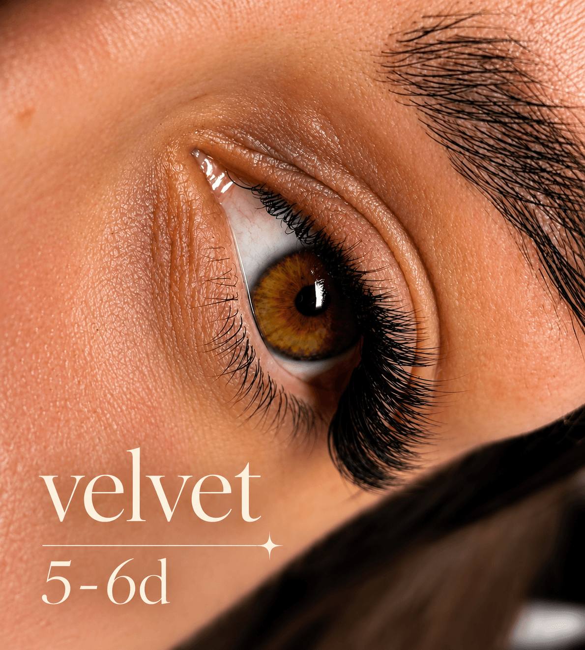 Close-up of a brown eye with voluminous black velvet 5-6d eyelash extensions.